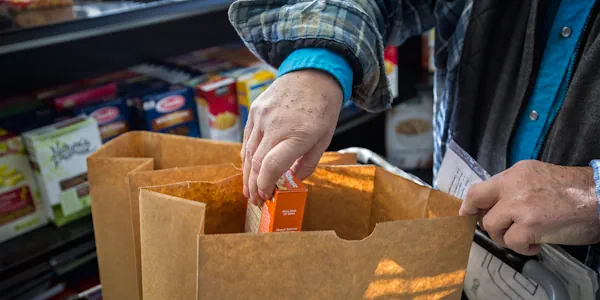 Client shopping at HC Food Bank-600×300